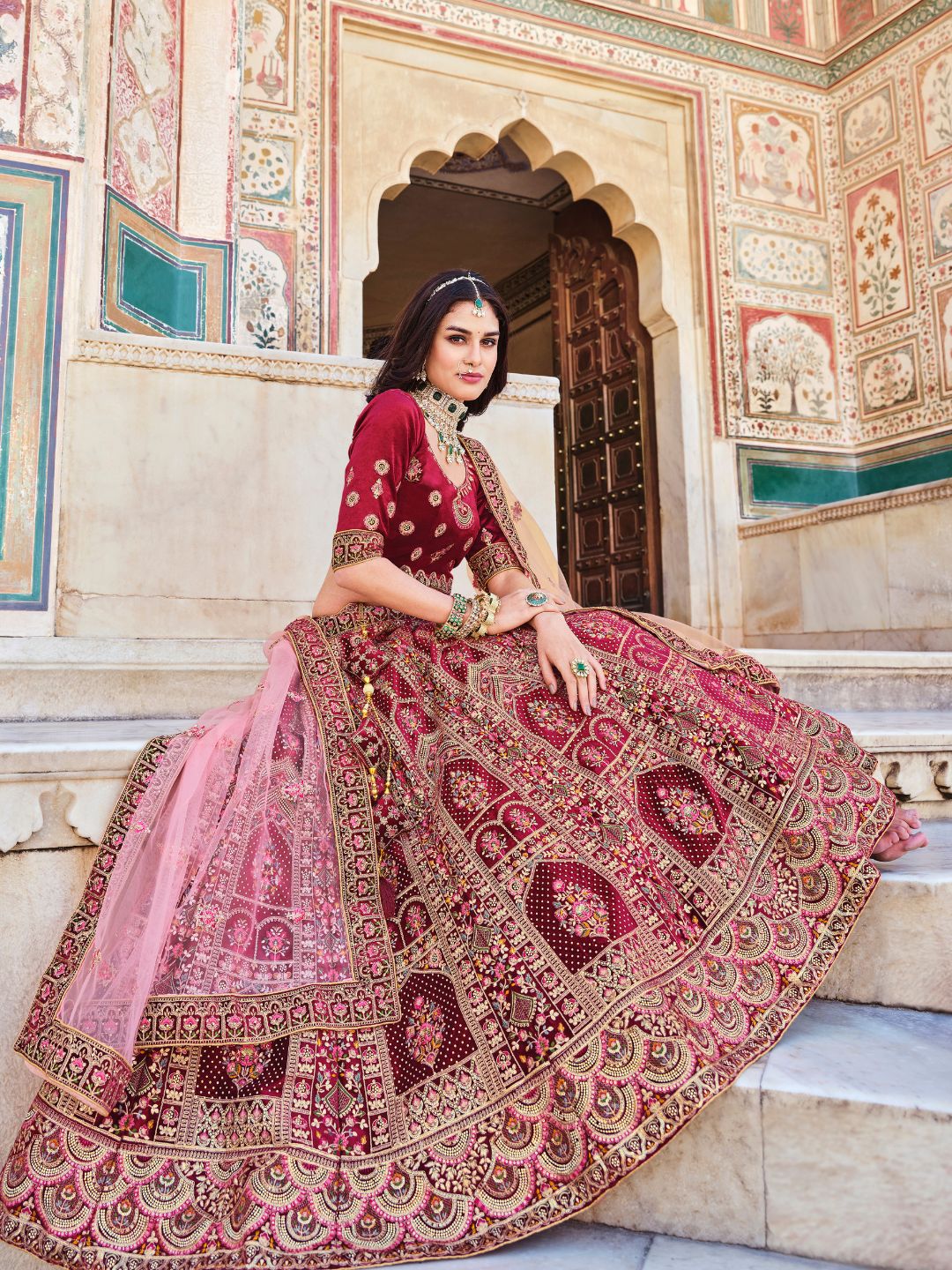 Stone Velvet Bridal Wedding Lehenga in Red and Pink