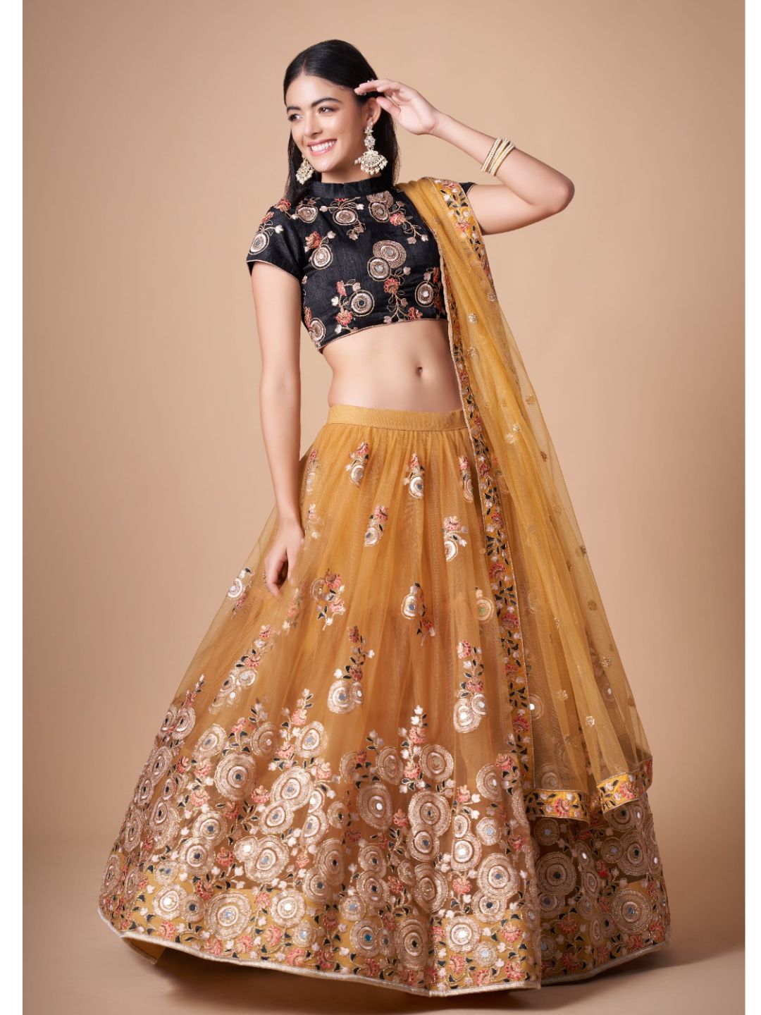 Sequence Net Bollywood A Line Lehenga in Gold